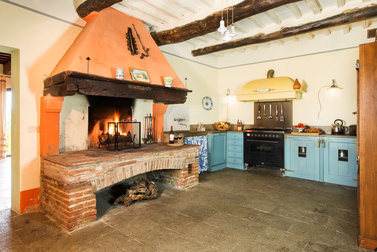Typical Tuscan cuisine with traditional stone fireplace
